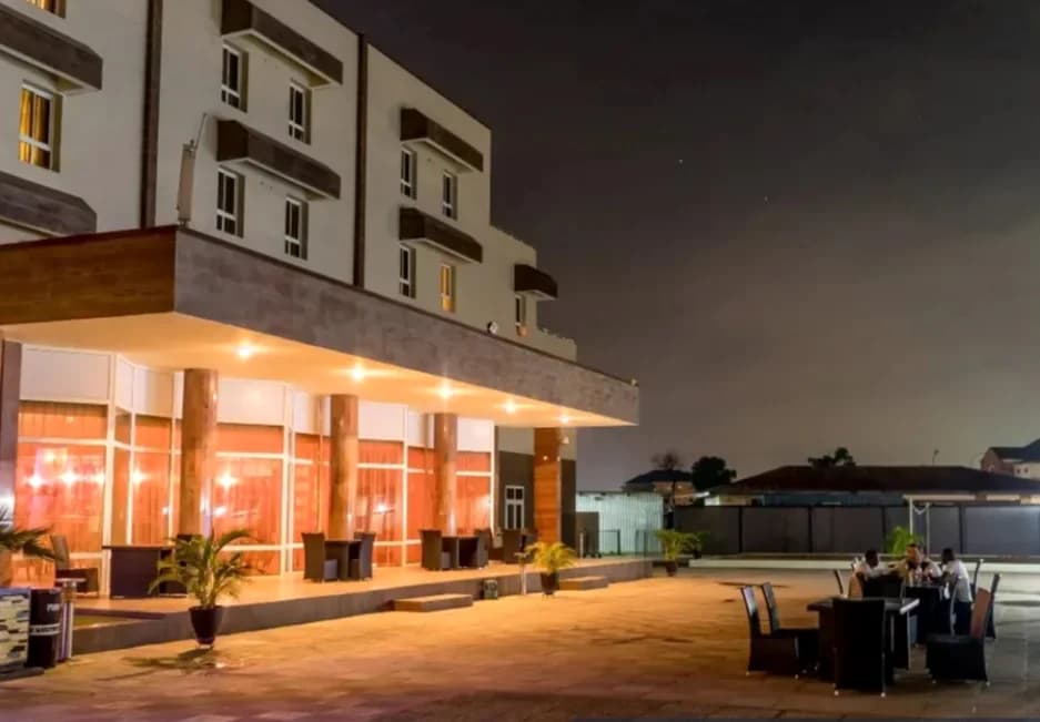 Hotel exterior at night.
